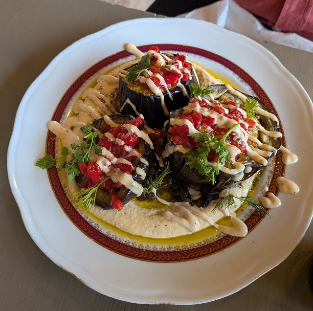 Representative photo: Baked aubergines in a Paris Bistro. Not this venue.