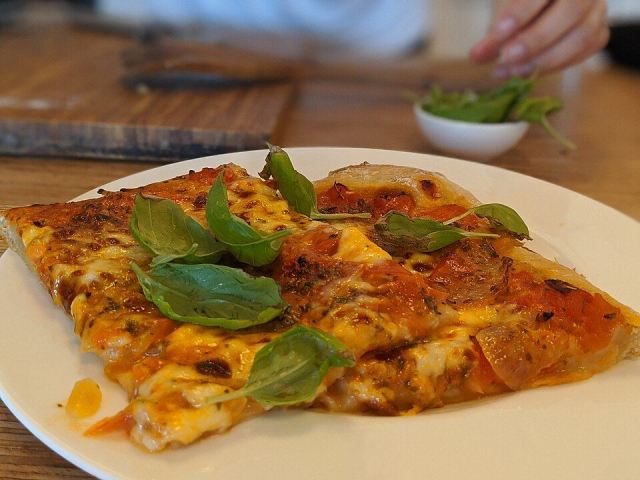 Representative photo: Margherita pizza on plate 2. Not this venue.
