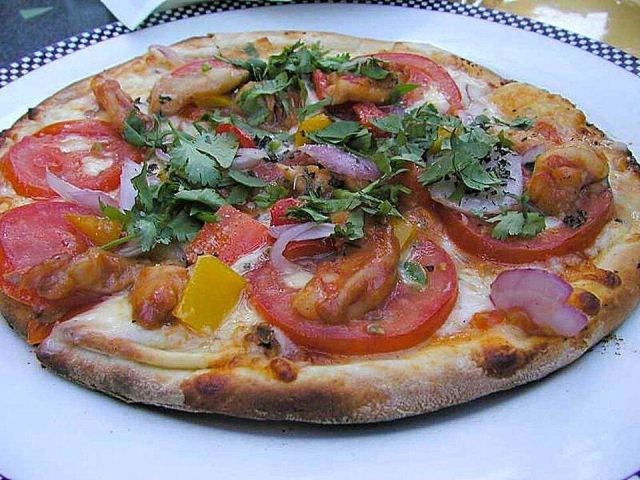 Representative photo: Pizza on plate. Not this venue.