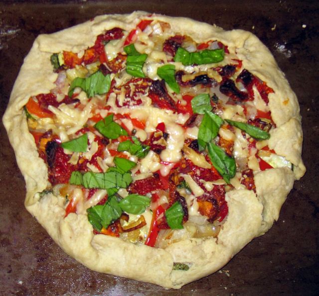Representative photo: Mediterranean rustic tart (7657279906). Not this venue.