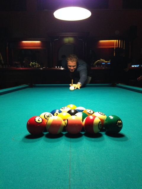 Representative photo: Man playing billiards. Not this venue.