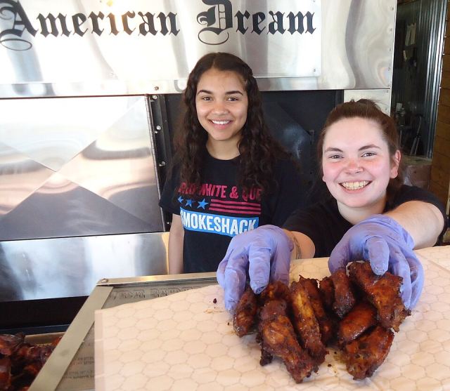 Representative photo: Servers and preparers with barbecue food at Red White and Que restaurant in New Jersey. Not this venue.