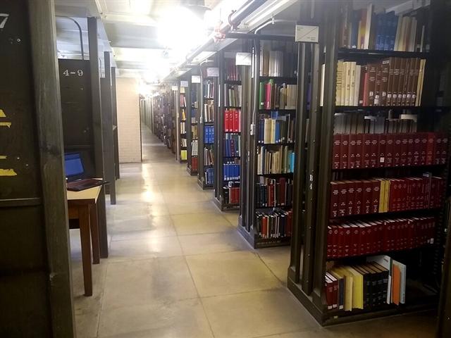 Representative photo: Library bookshelves. Not this event.
