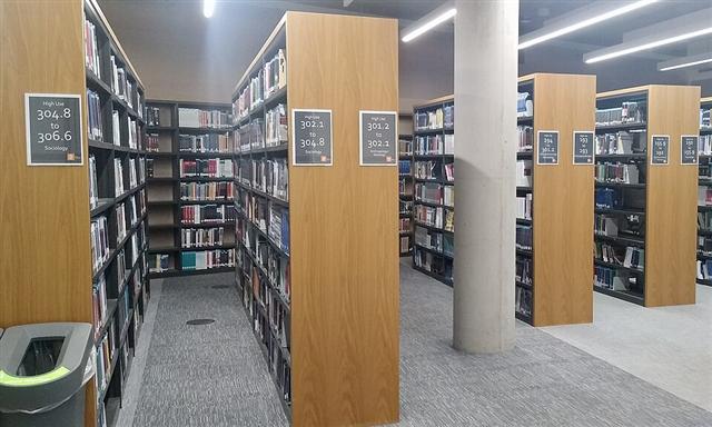 Representative photo: Library bookshelves. Not this event.