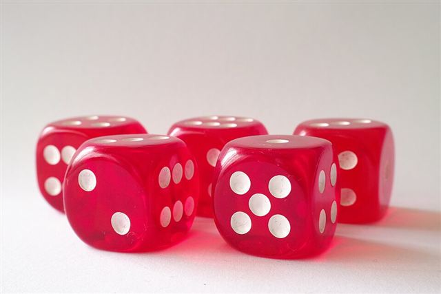 Representative photo: Red tabletop dice. Not this venue.